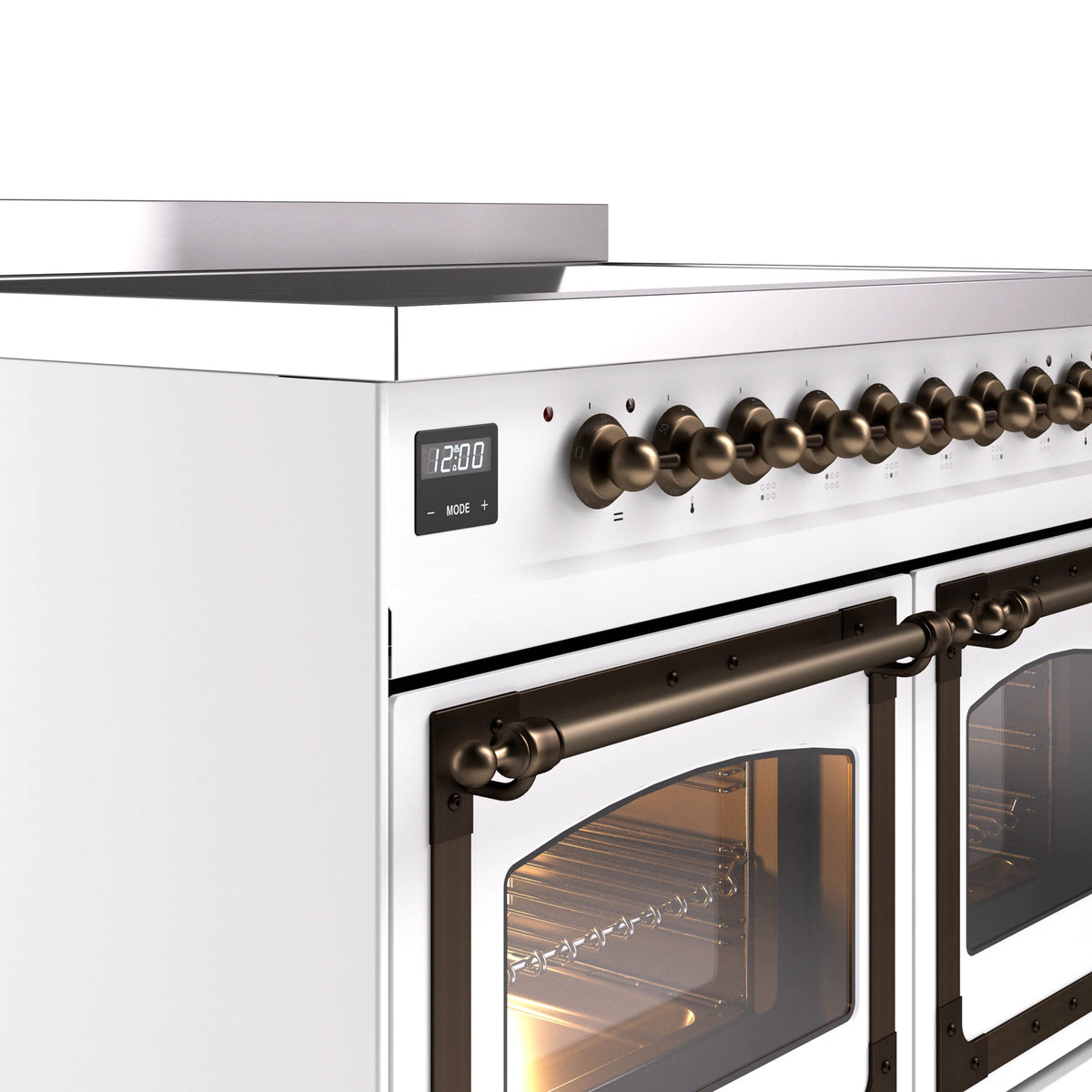 Bronze control knobs and oven door handle on a white induction range