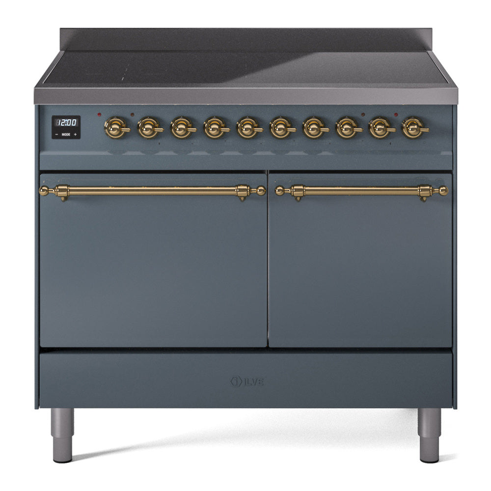Blue-grey induction range with dual oven doors, brass bar handles, and knob controls