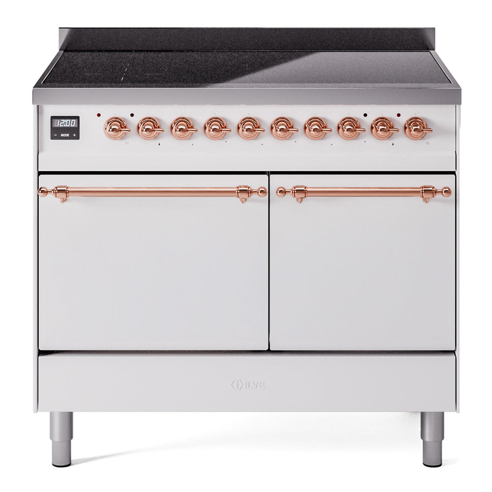 White induction range with copper burner knobs and dual oven doors