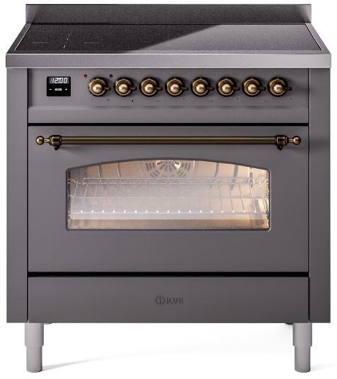 Freestanding induction range with matte graphite finish, bronze knobs, and oven window