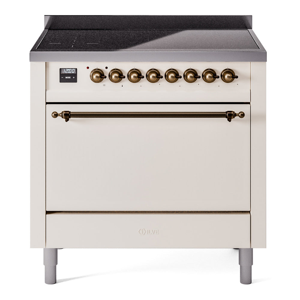 Antique white induction range with bronze knobs, digital display, and closed oven door