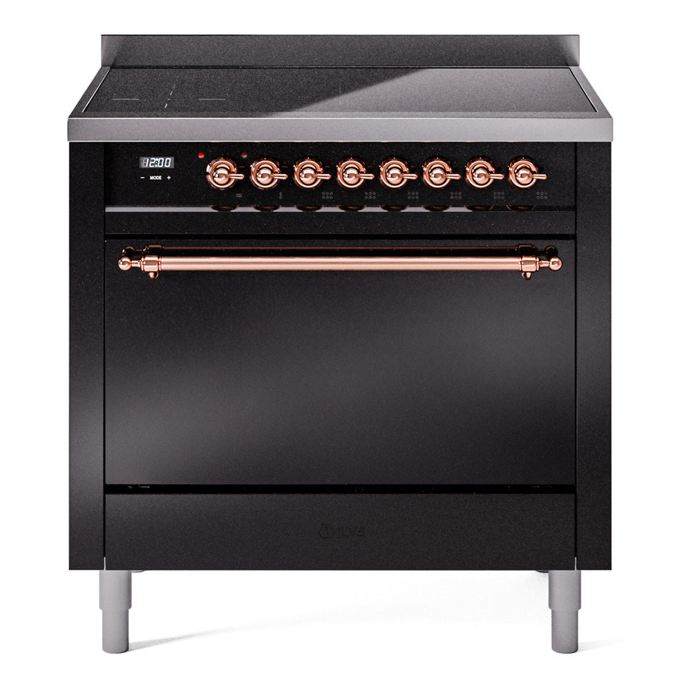 Glossy black induction range with solid oven door and copper control knobs