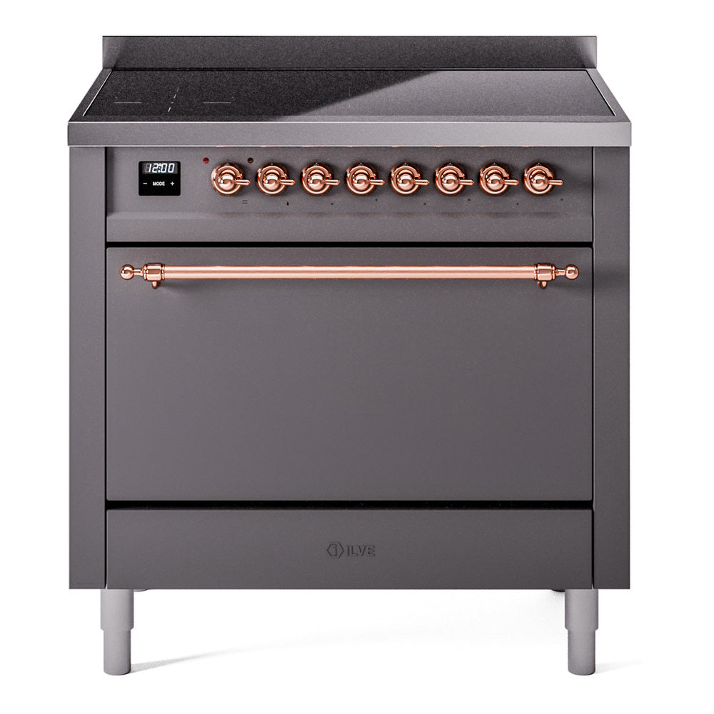 Matte graphite induction range with closed oven door and copper control knobs
