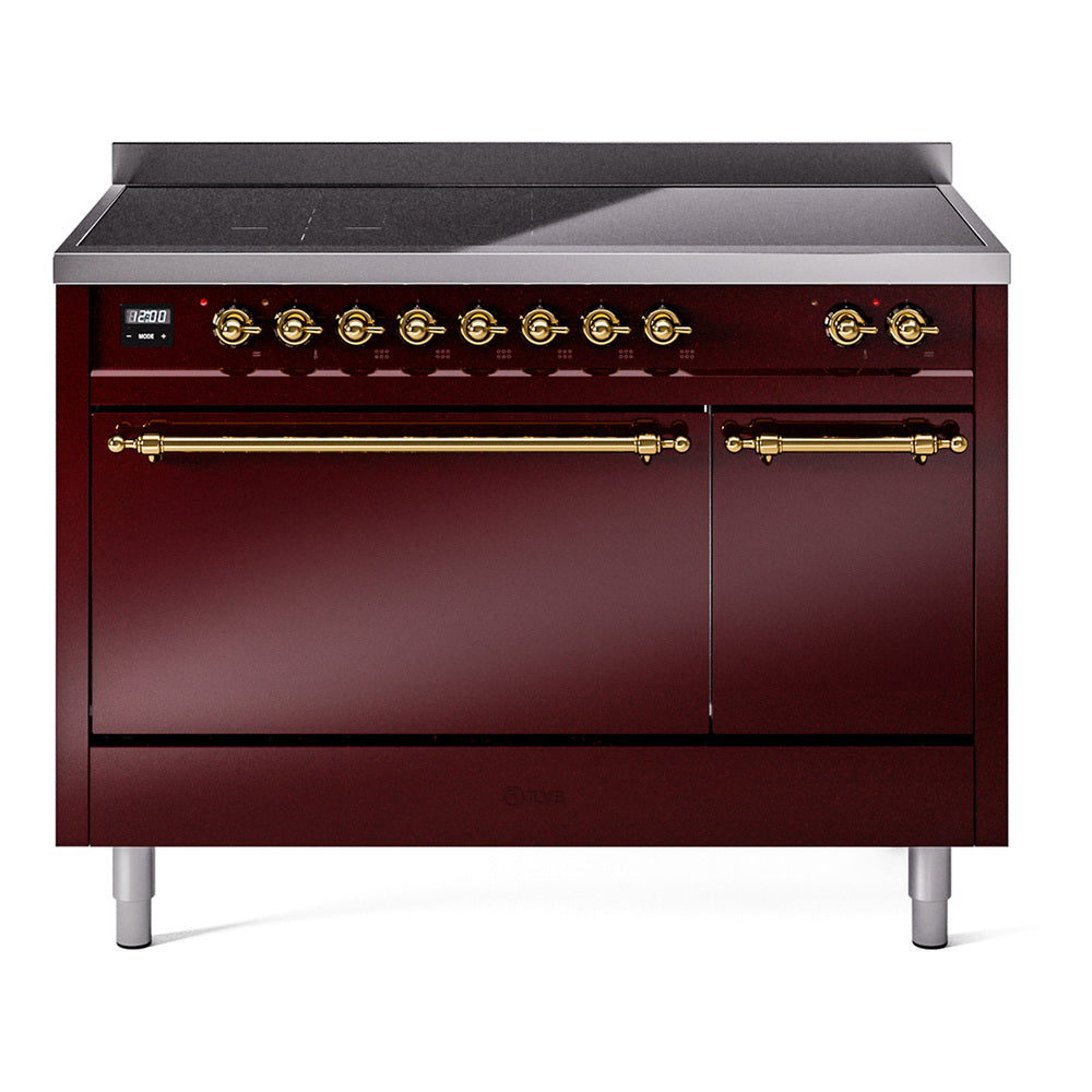 Burgundy induction range with brass knobs, stainless cooktop, and oven doors