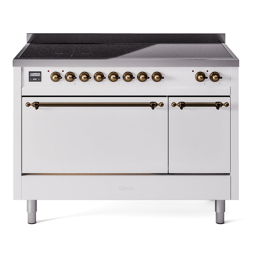 Stainless steel cooktop range with white double oven doors and bronze control knobs