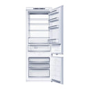 Built-in bottom freezer refrigerator open, showing freezer drawers and fridge shelves in white