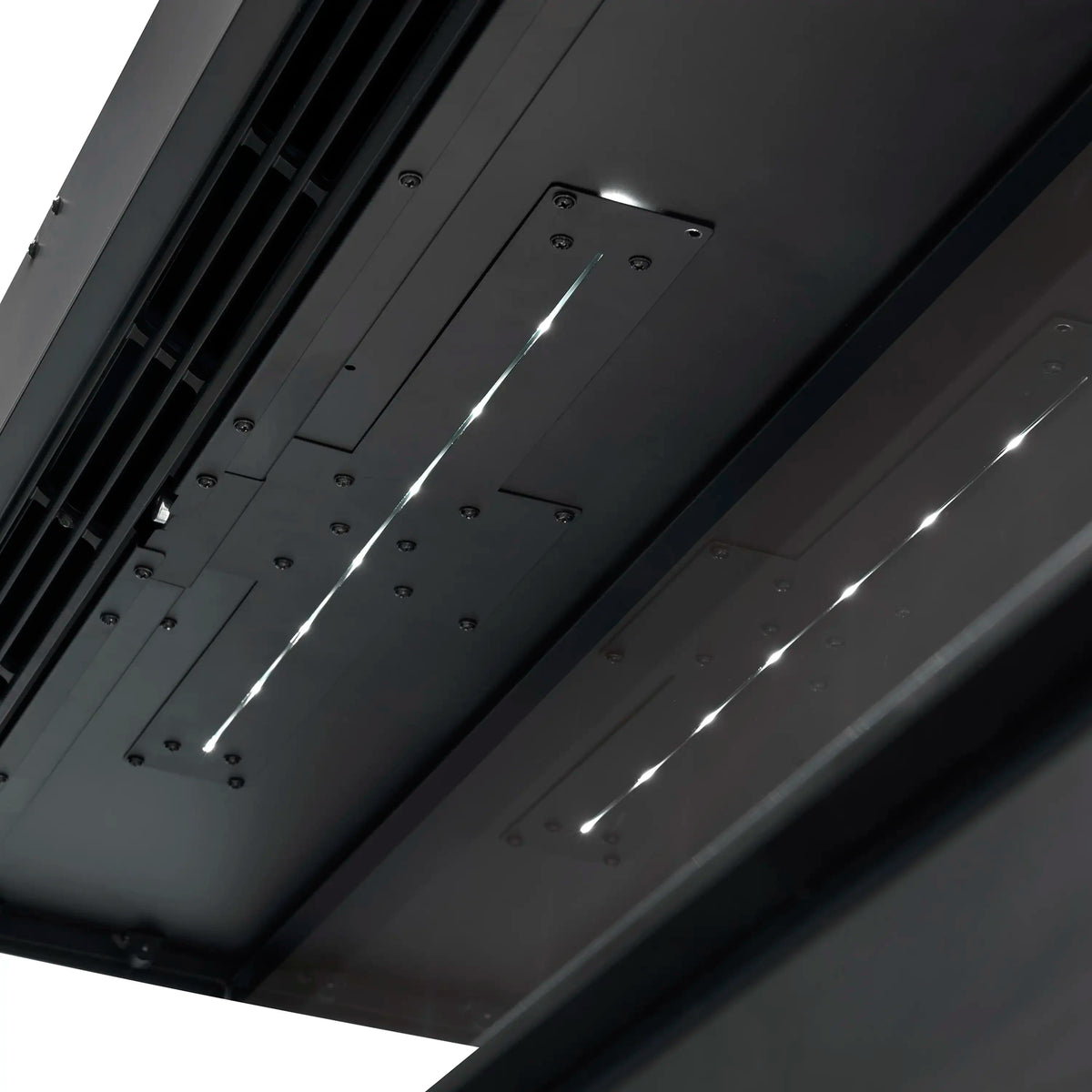 Close-up of interior LED flame module and vented metal housing on electric fireplace