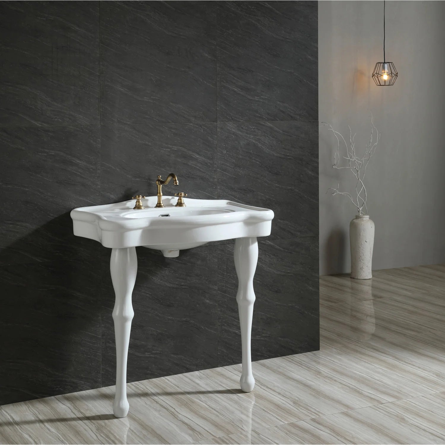 White ceramic console sink with gold faucet and pedestal legs, glossy oval basin