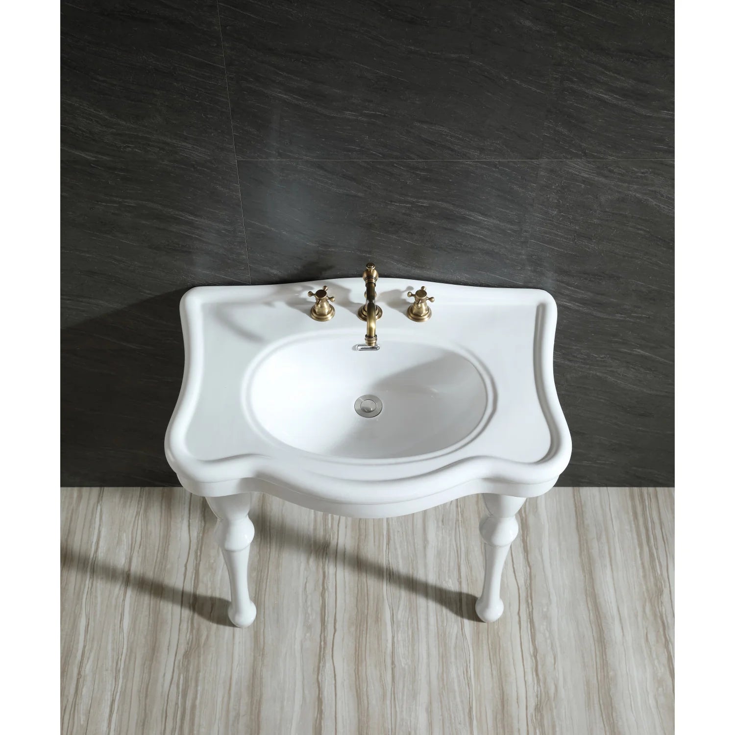 White ceramic console sink with gold faucet set, curved backsplash, oval single basin