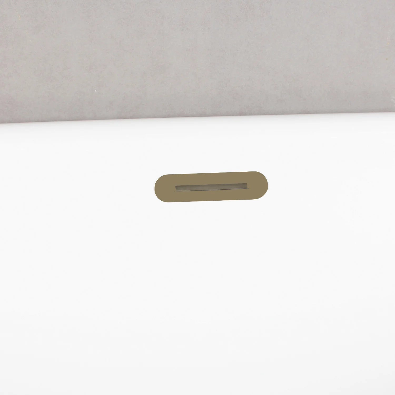 Antique brass rectangular overflow cover on white acrylic tub