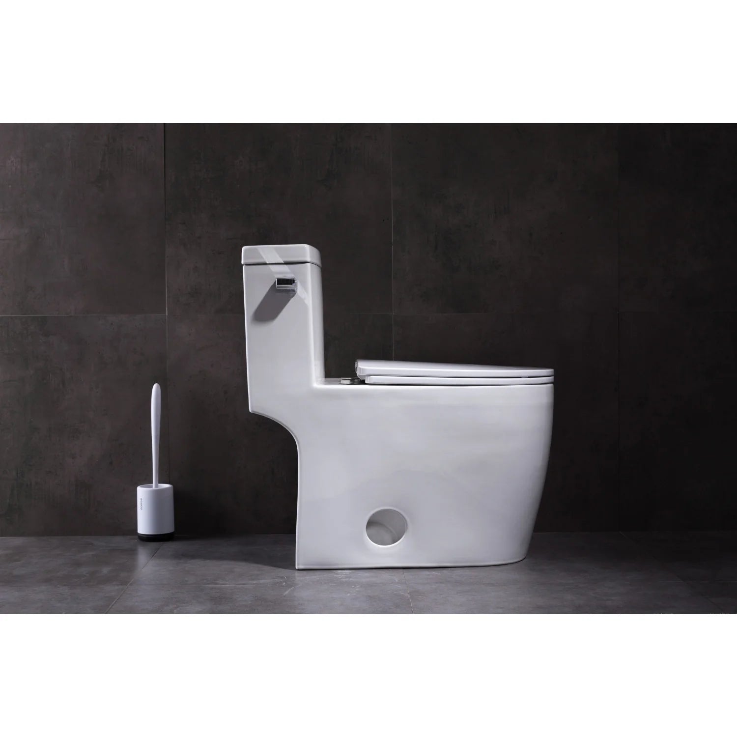 One-piece elongated toilet in white, side view with wall-mounted flush area