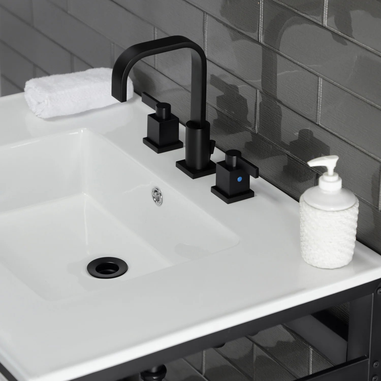 White ceramic console sink with matte black faucet and 3-hole fixture layout