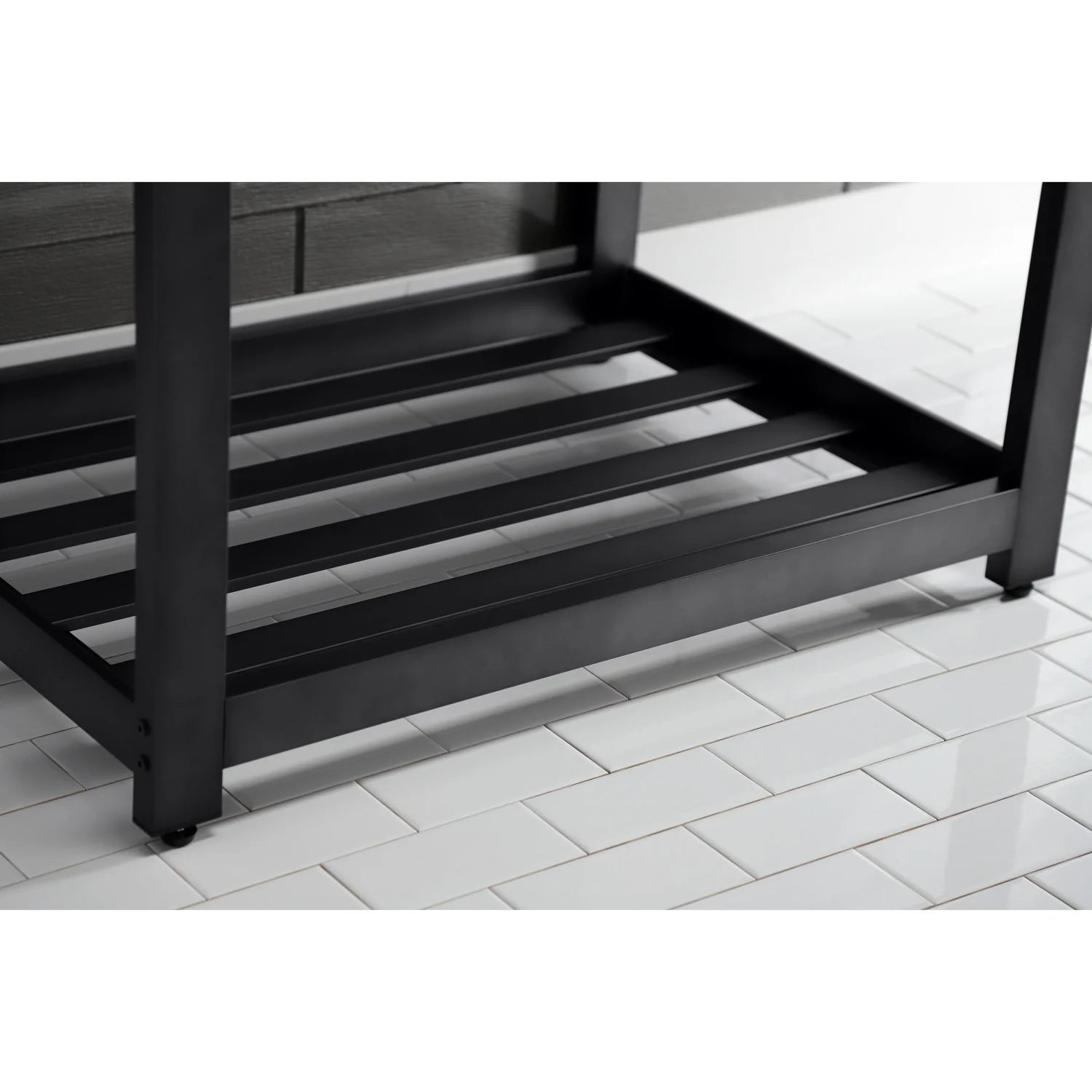 Matte black steel base with open slat shelf under a white ceramic console sink
