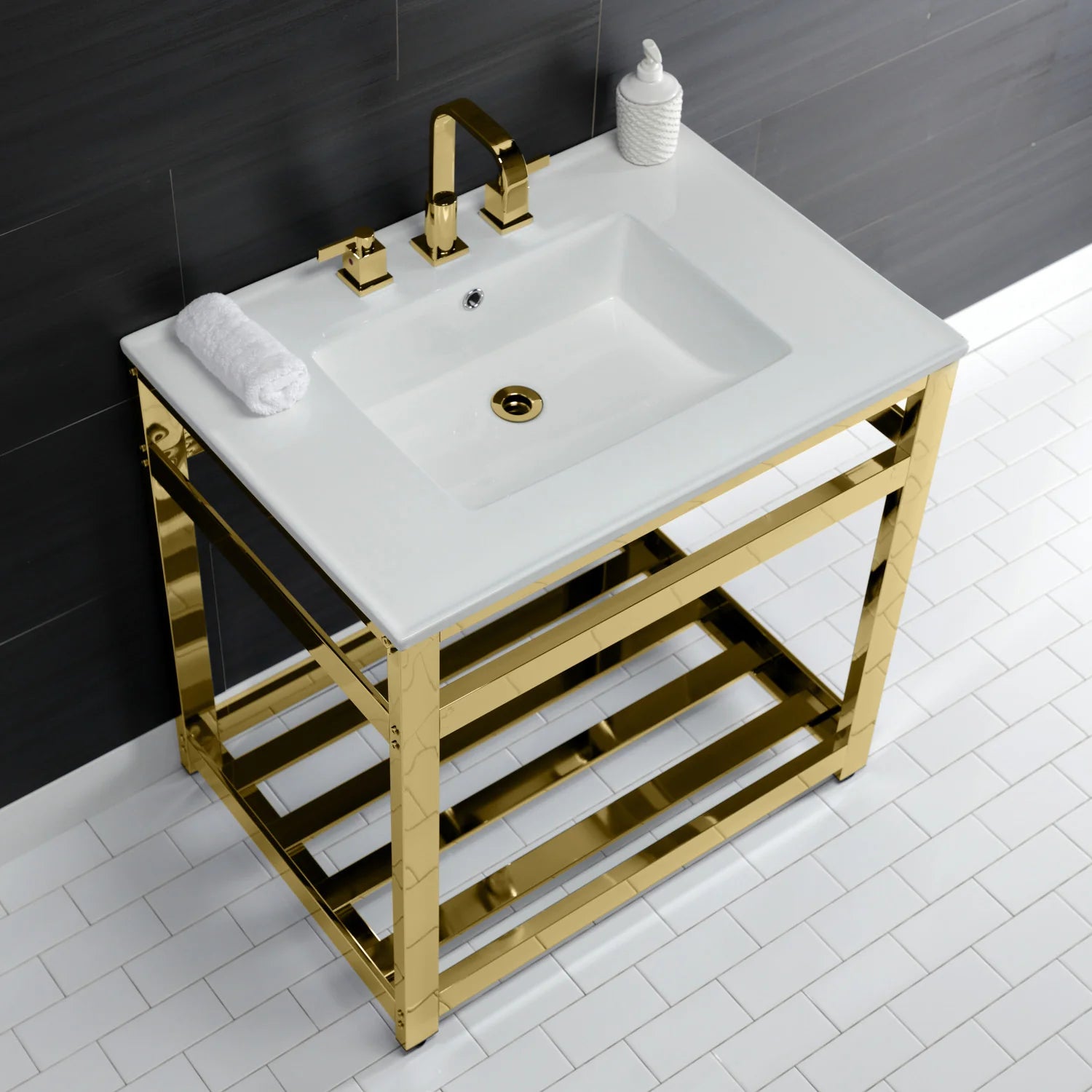 White ceramic console sink with polished brass faucet set and towel on brass base