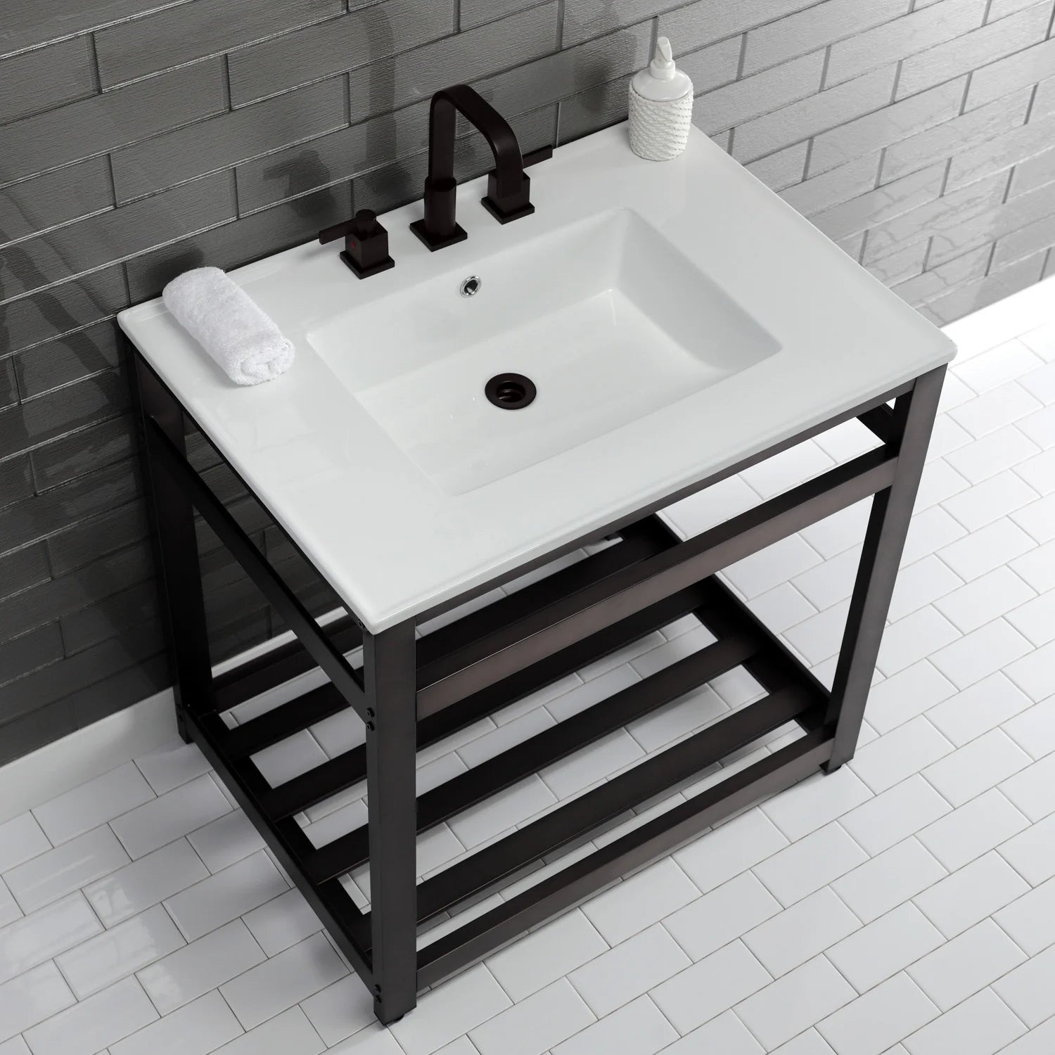 White ceramic console sink with dark bronze faucet, towel, and open lower shelf