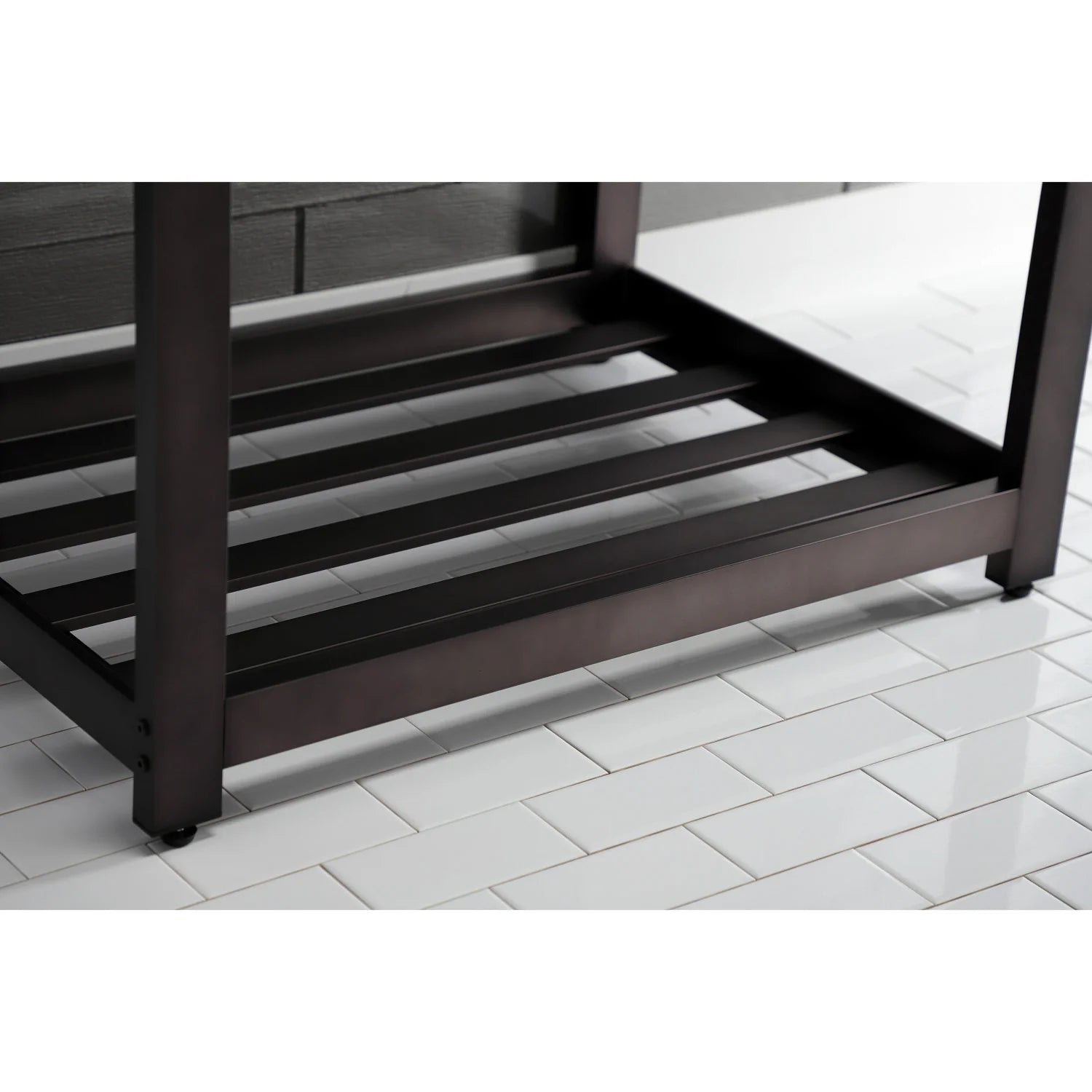 Dark bronze lower rack of a console sink cabinet beneath the white sink top