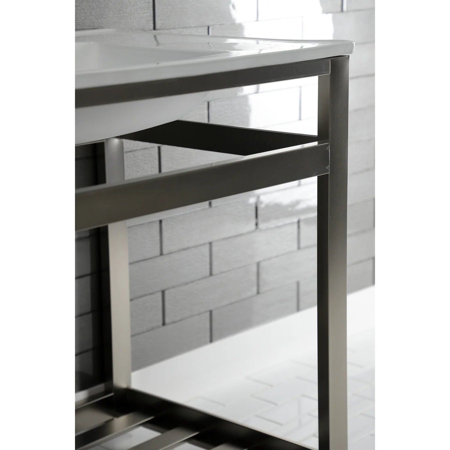 Steel console sink base with open slatted shelf and legs, underside view