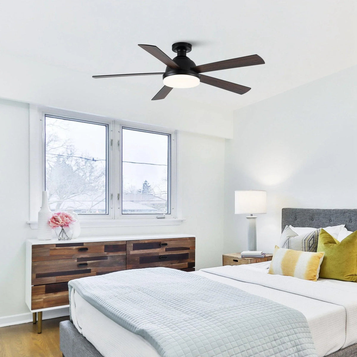Black 52-inch ceiling fan with LED light mounted on a ceiling