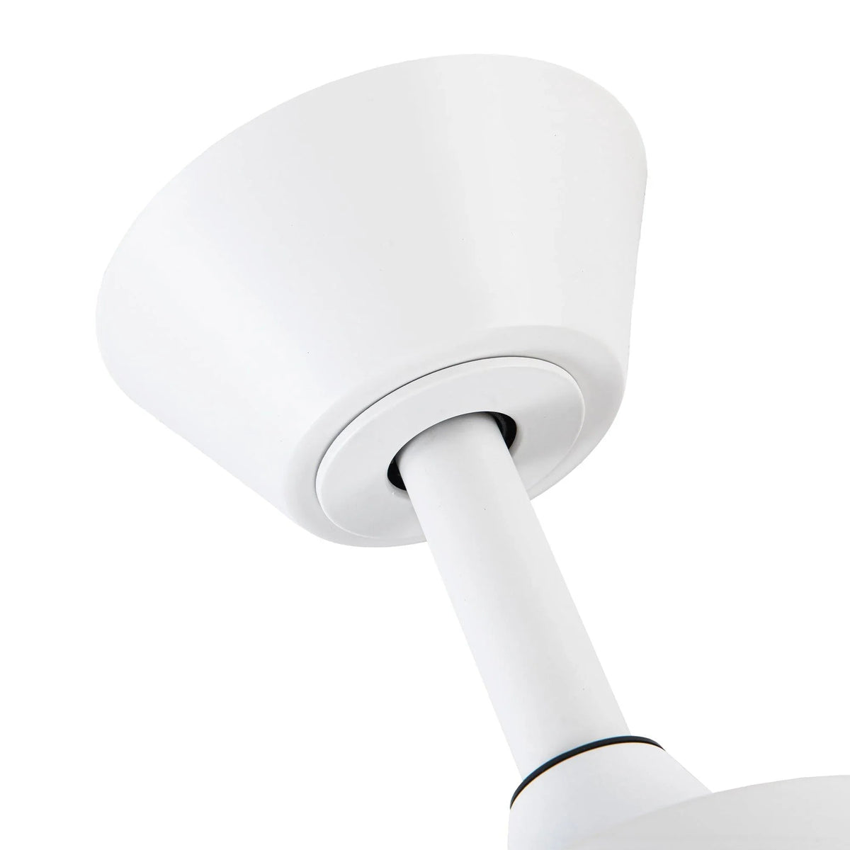 Close-up of white ceiling fan motor housing and downrod with round light cap