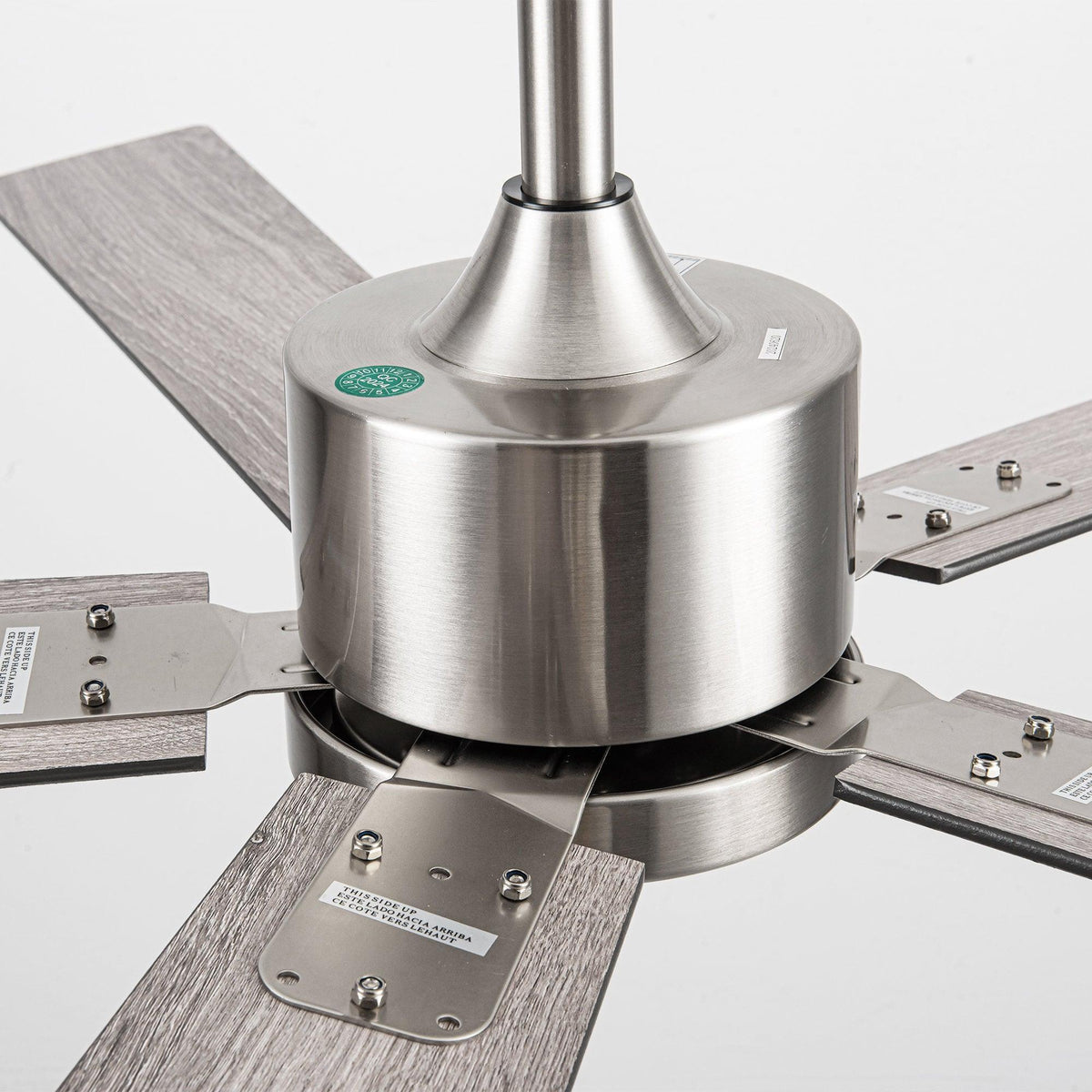 Brushed nickel ceiling fan motor housing with five blade arms and mounting plate
