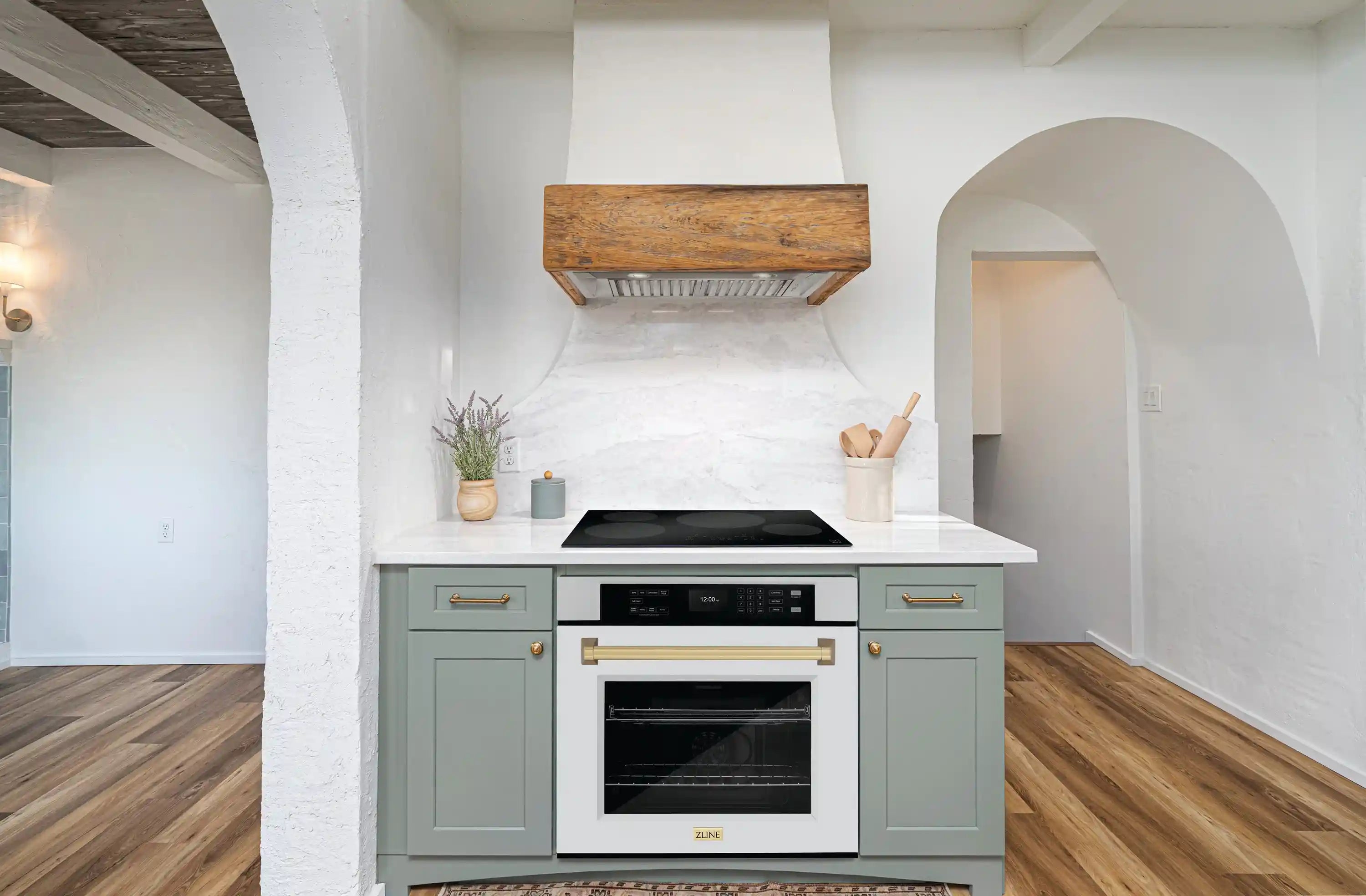 Built-in single wall oven with white matte door and champagne bronze handle