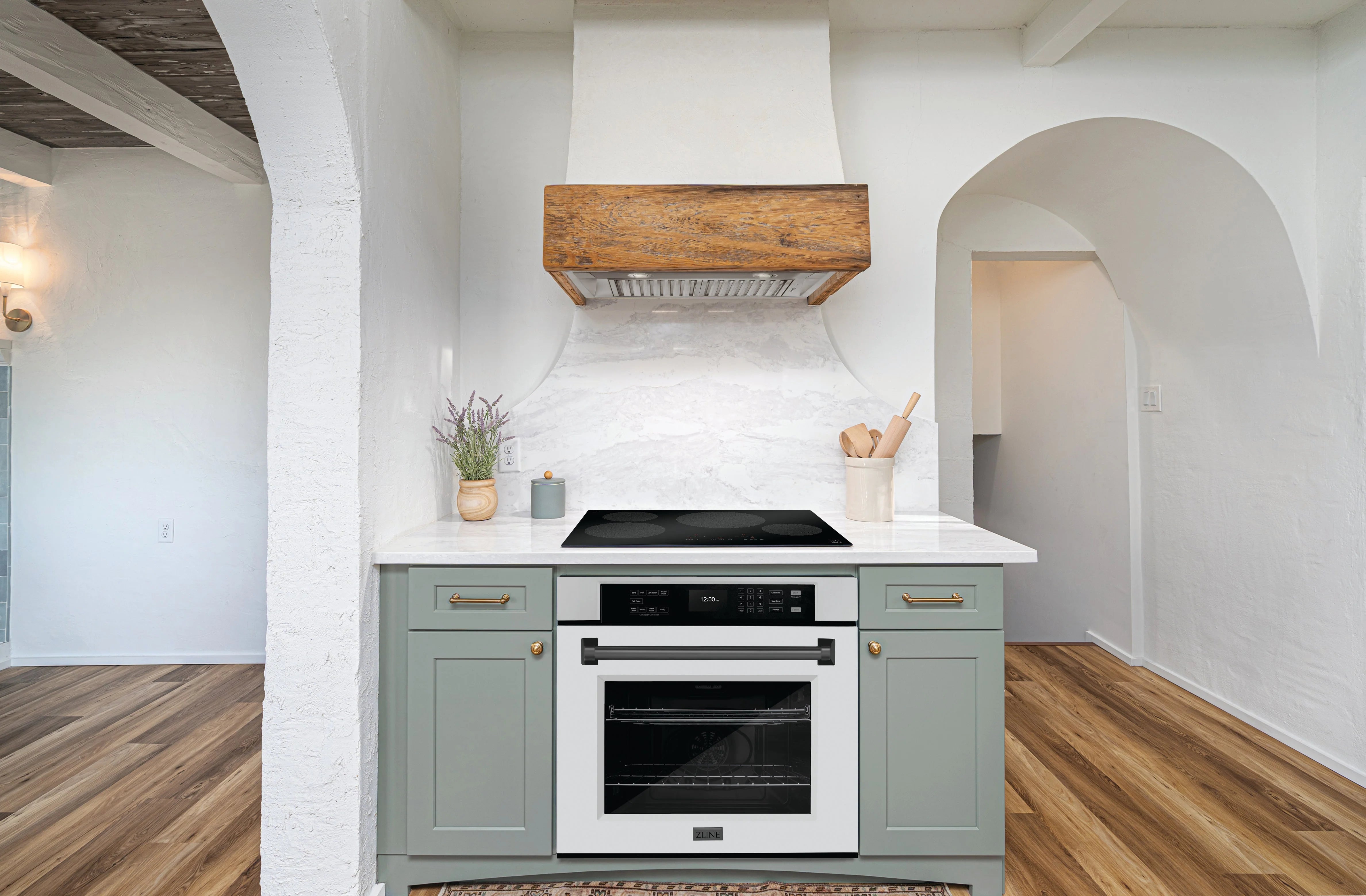 Built-in stainless steel single wall oven installed in light kitchen cabinetry