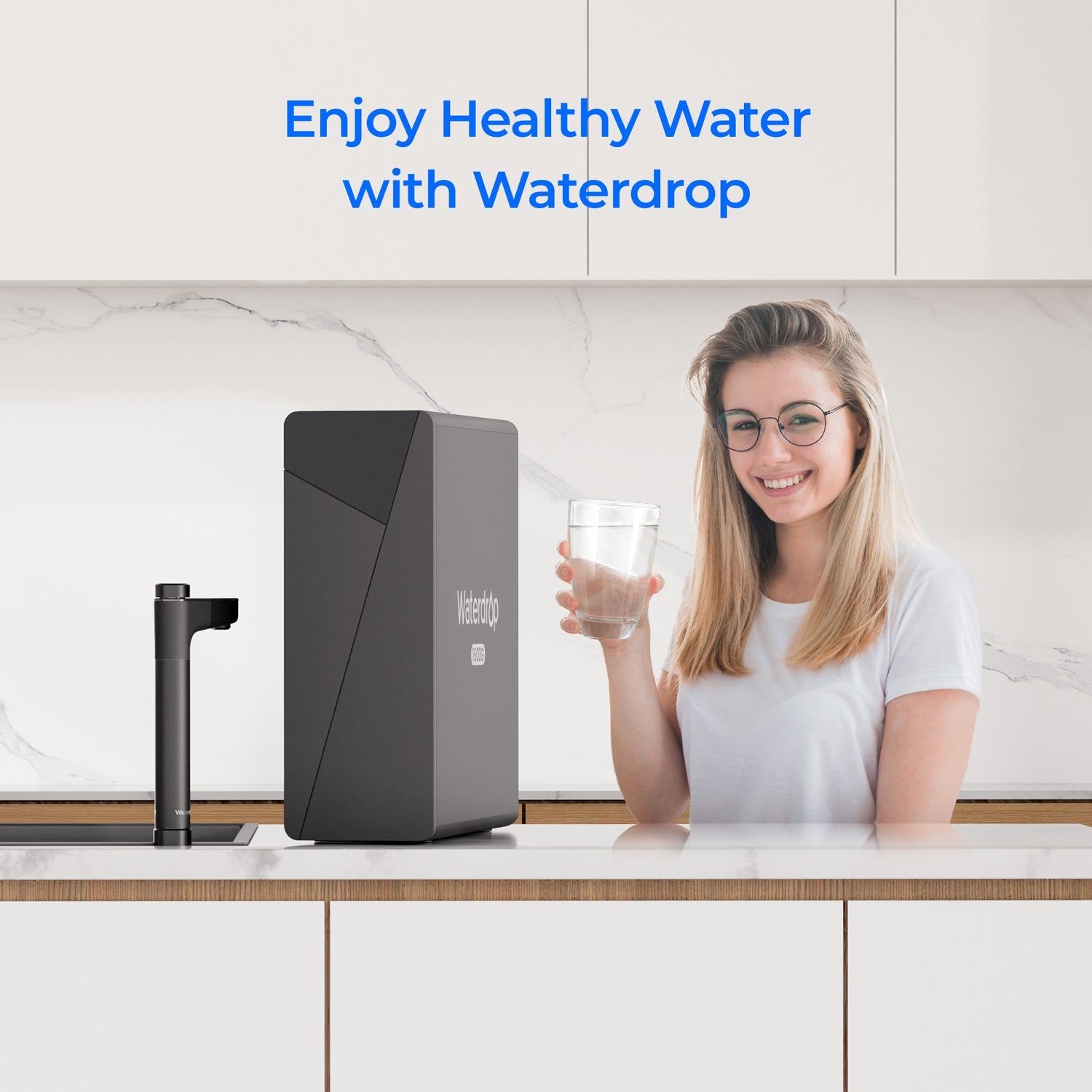 Dark water purifier unit beside a woman holding a glass of water