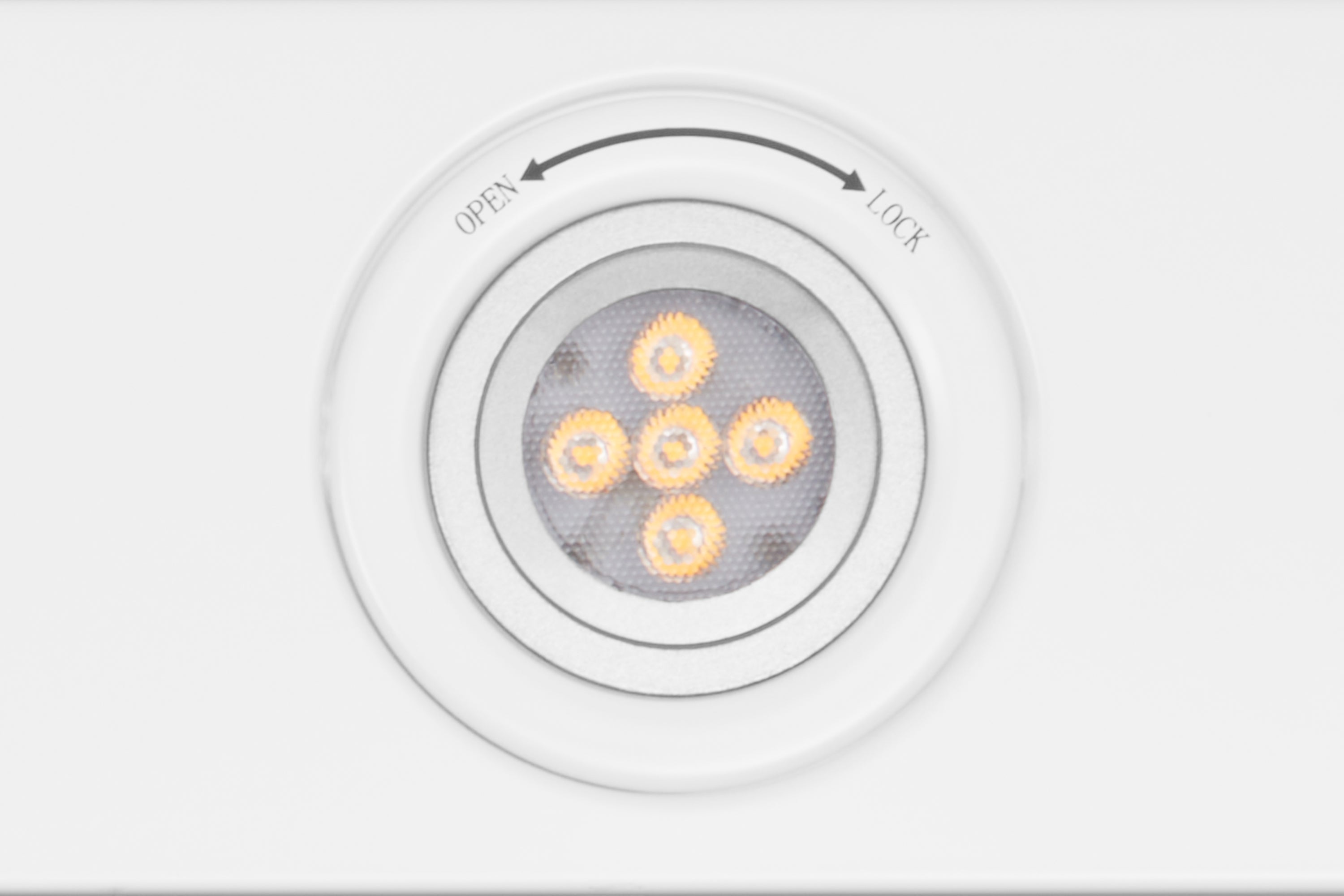 Range hood control area with circular LED cluster and open/lock labels
