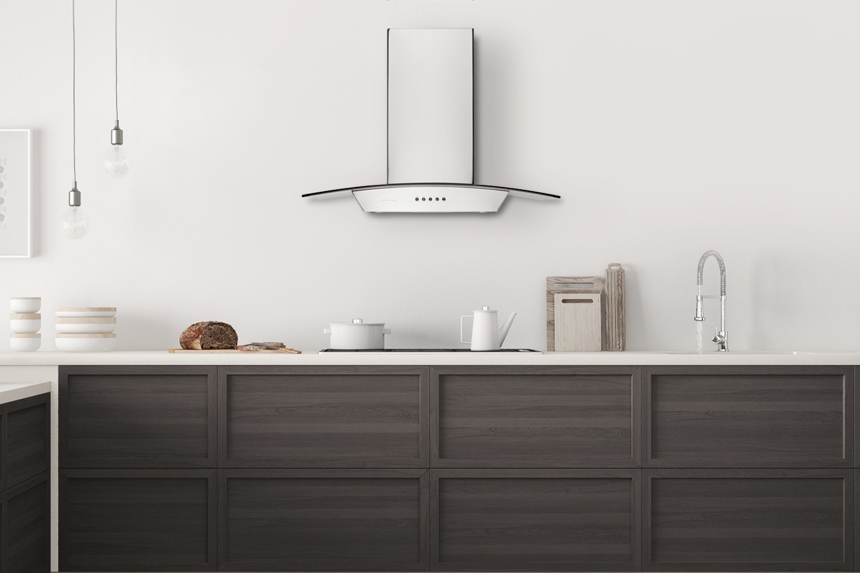 Wall-mounted stainless steel range hood with slim control panel under a curved canopy