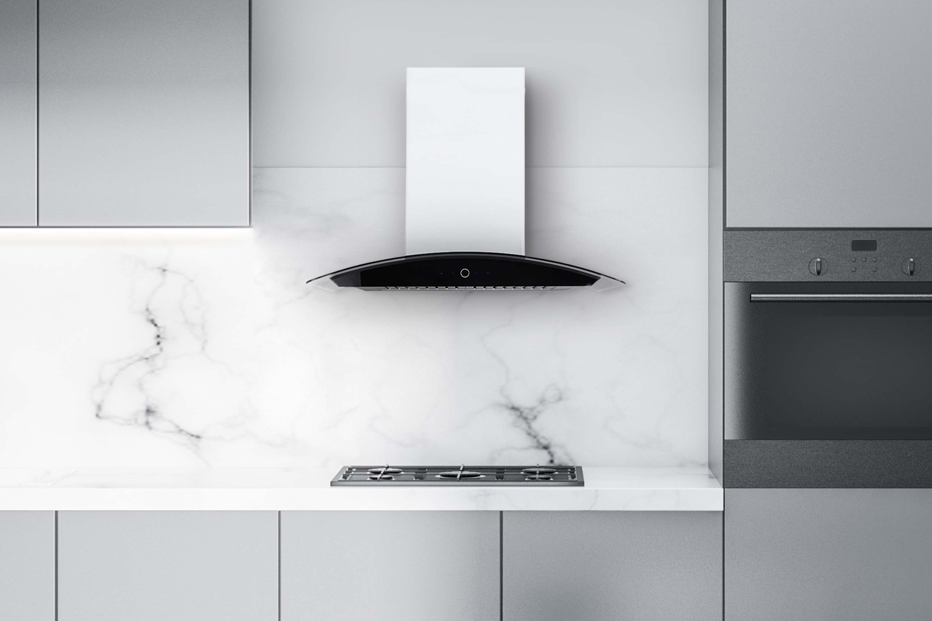 Stainless steel range hood centered over cooktop with vented canopy