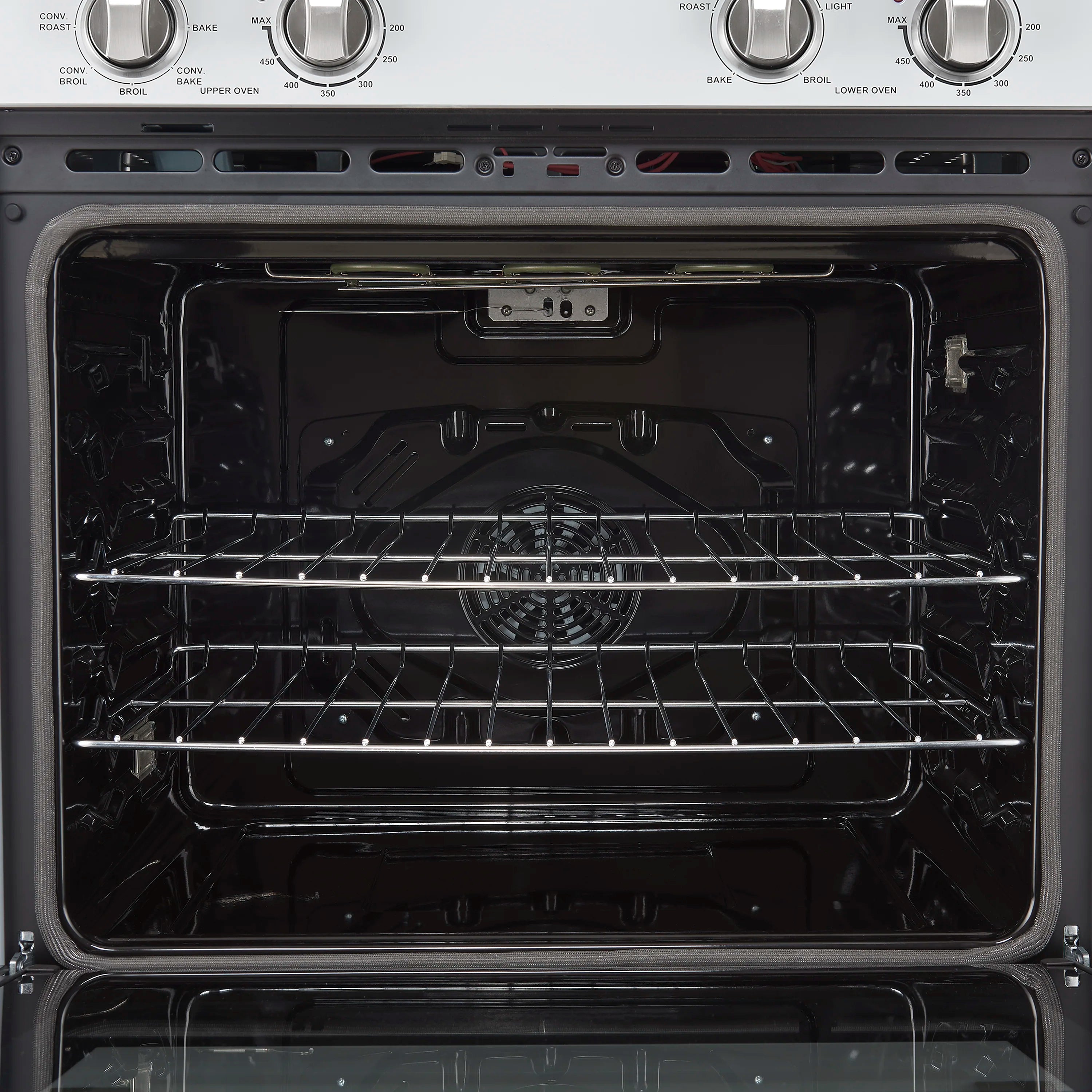 Double wall oven interior with top oven racks and fan in the back