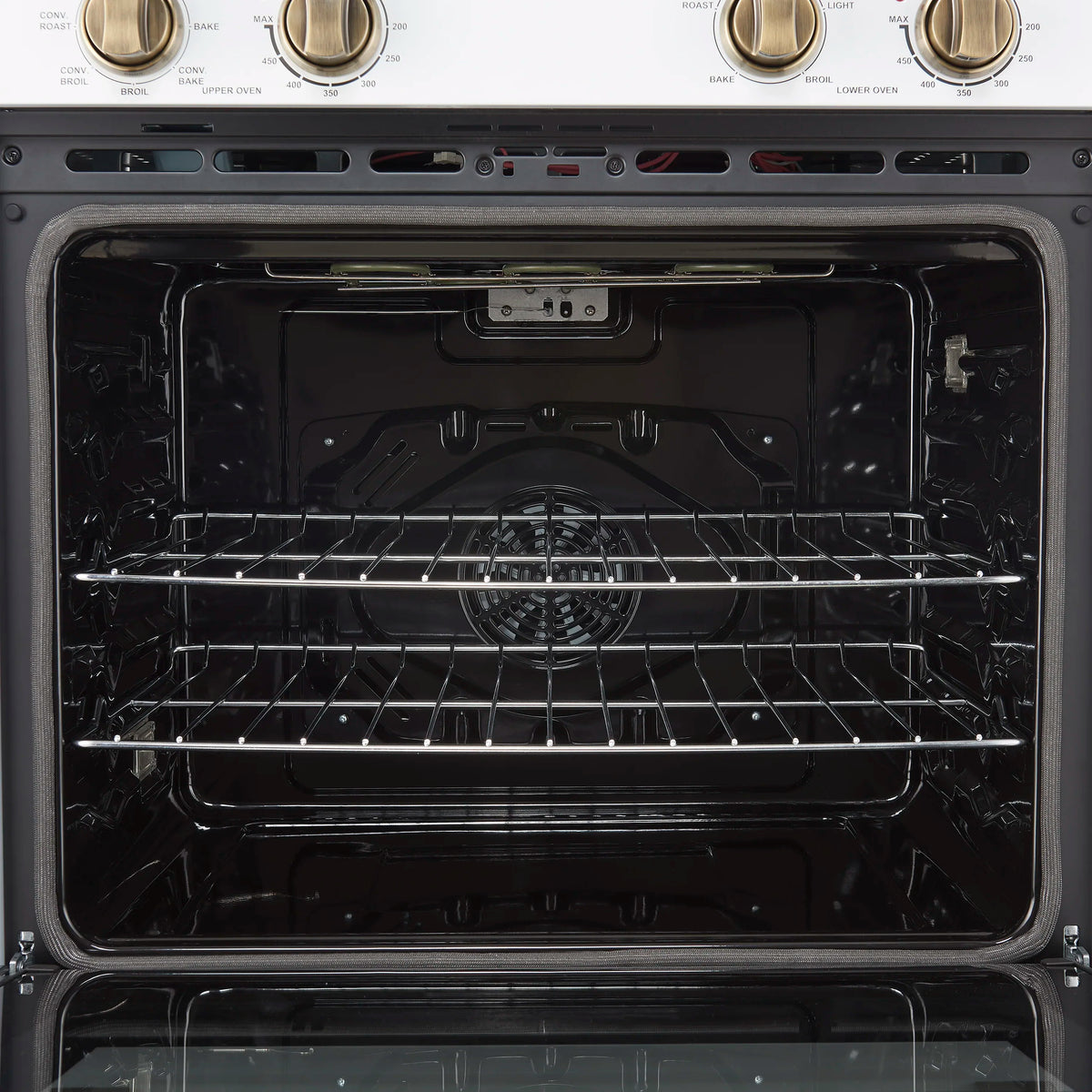 Lower oven interior with dark cavity, chrome wire rack, and back heating elements