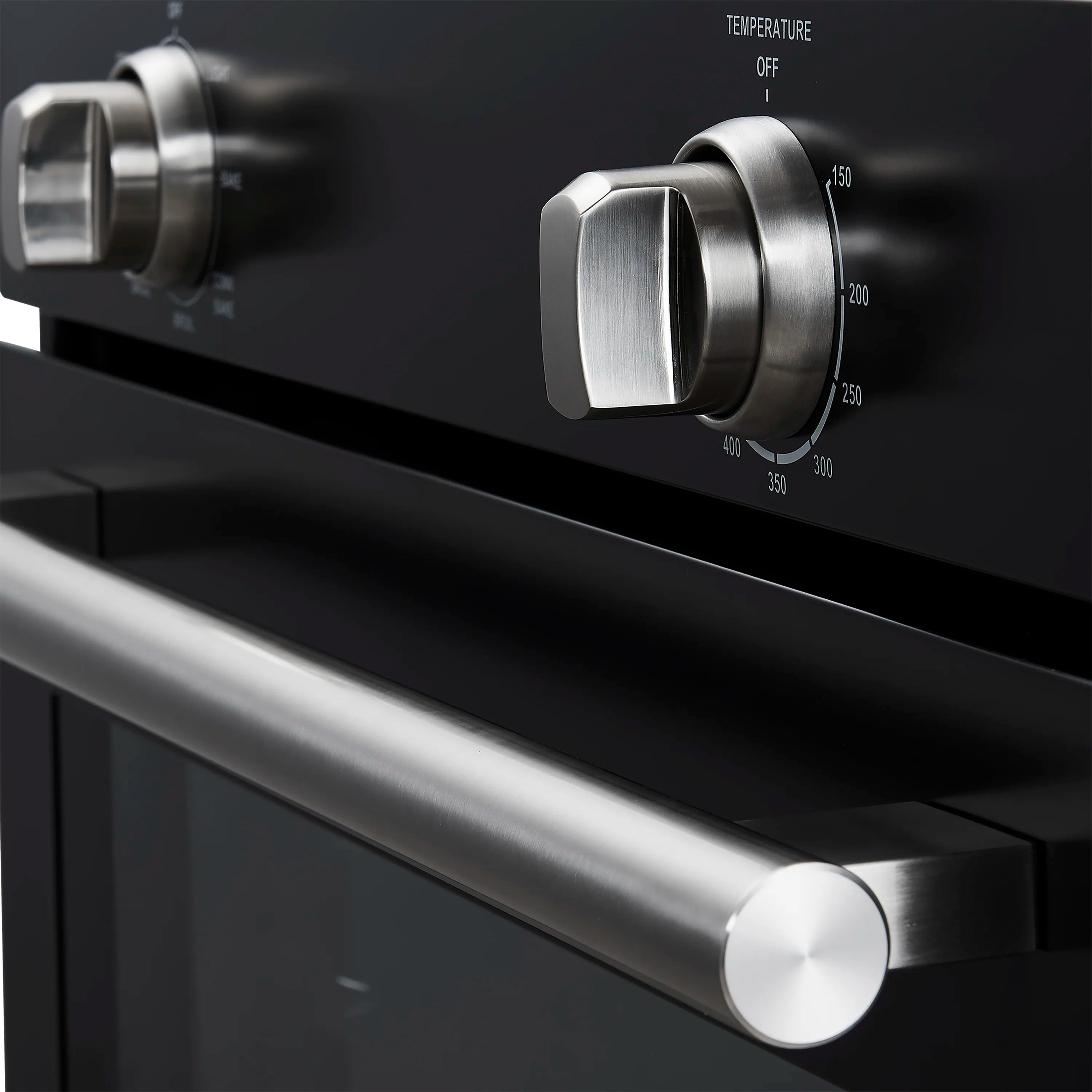 Stainless steel oven control knobs on black panel with temperature markings
