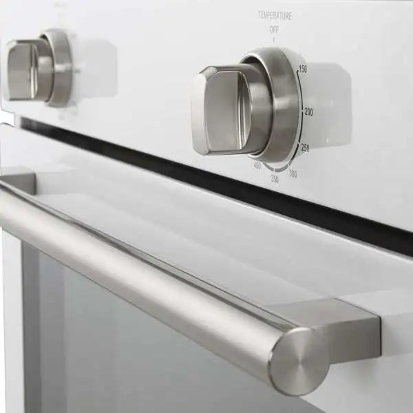 Stainless steel wall oven handle and control dial panel on white front