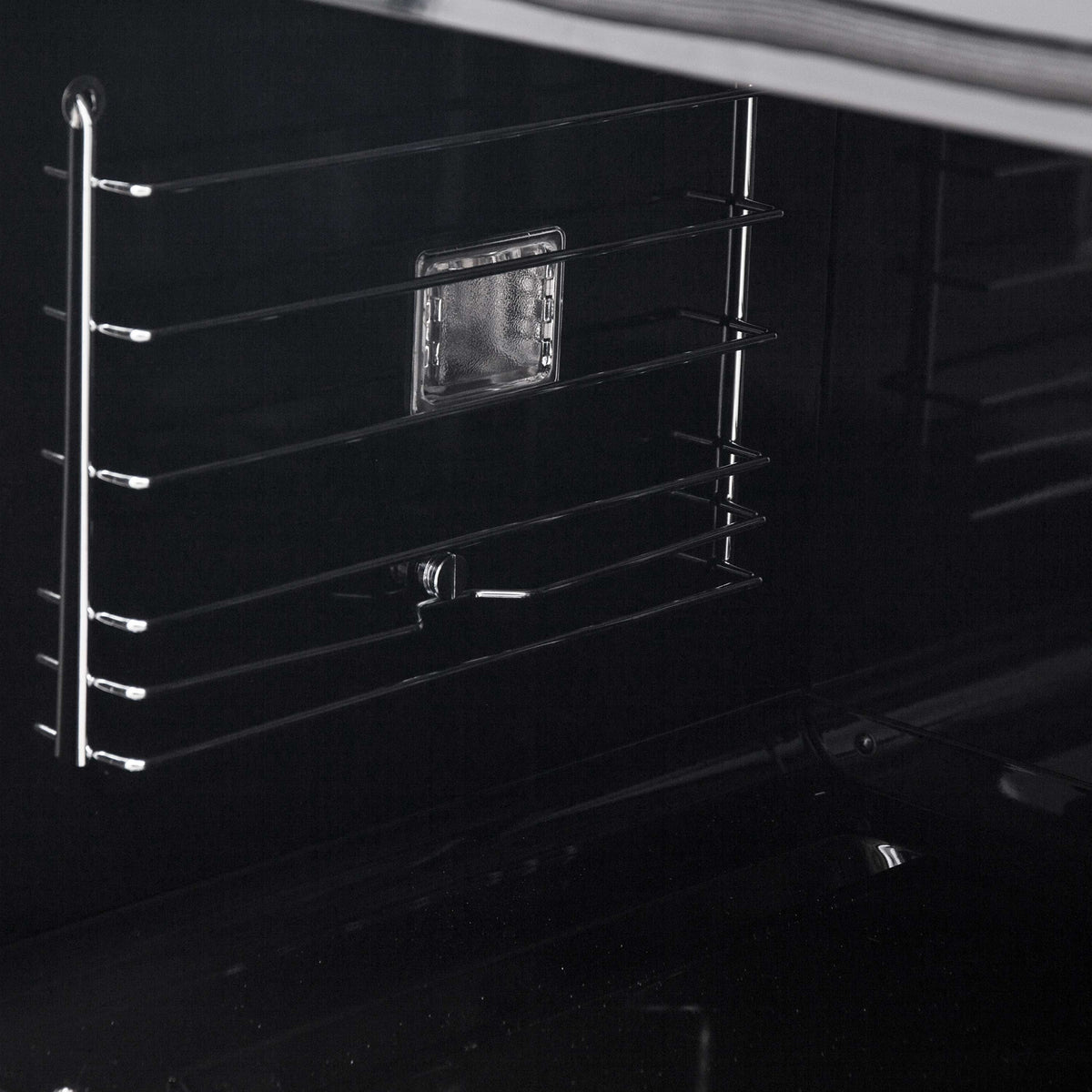 Black oven interior with wire racks and open door cavity