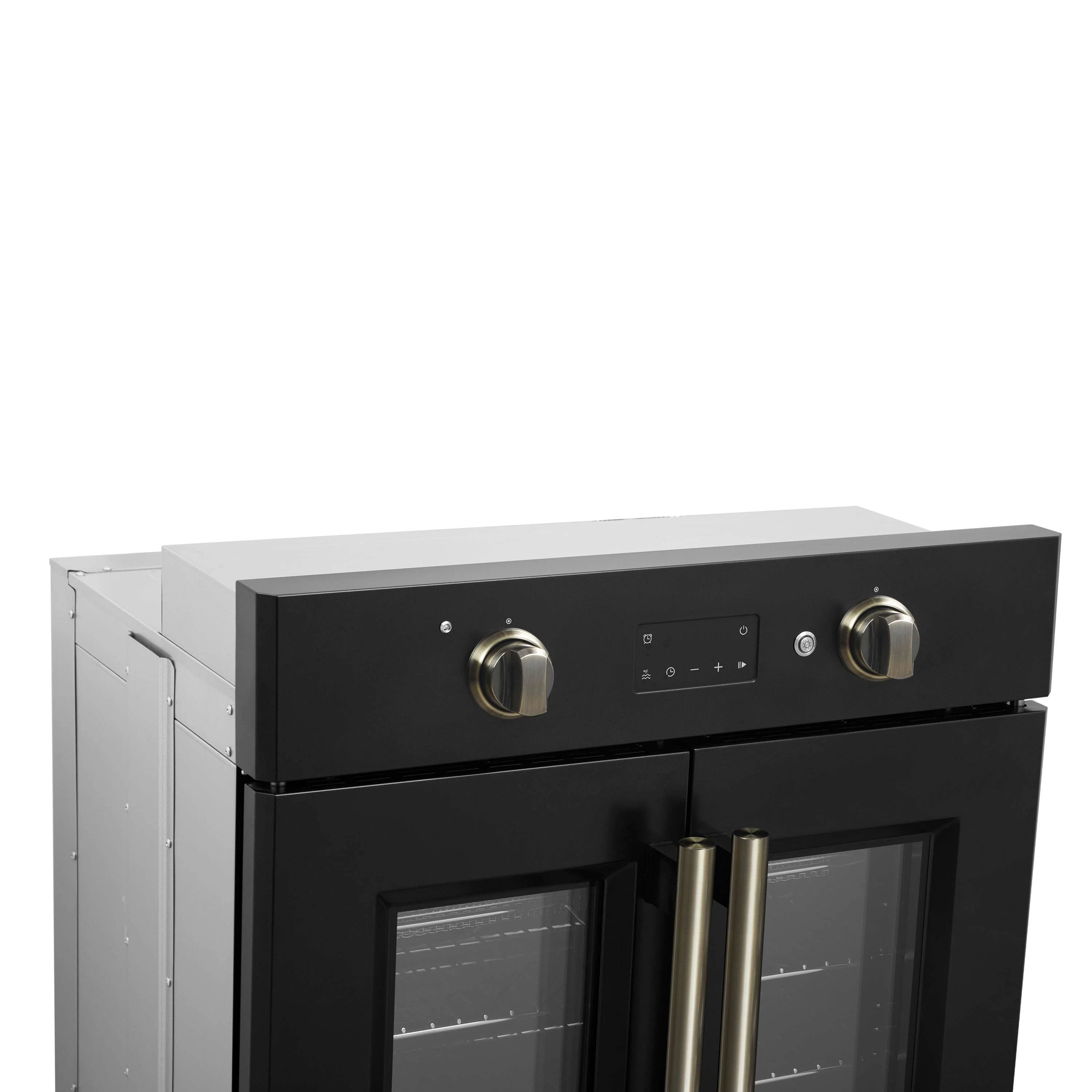 Black electric wall oven with French doors closed, brass handles and control panel