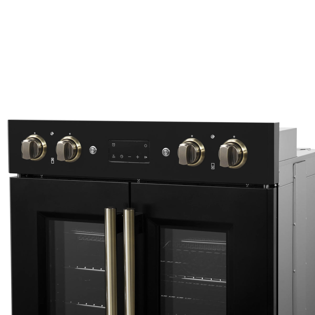 Black double wall oven with upper and lower French doors, brass vertical handles and knobs