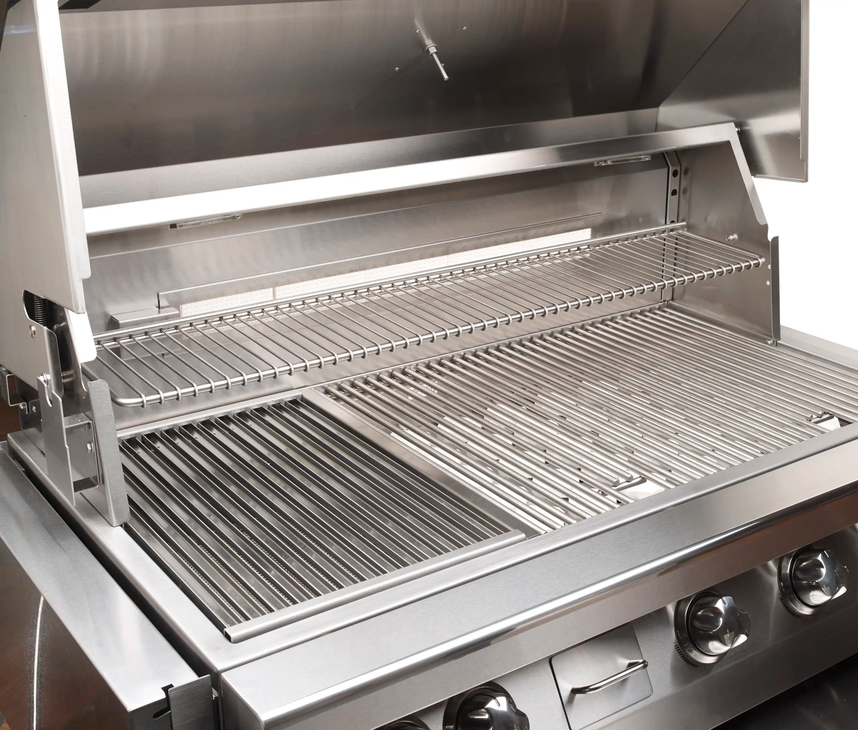 Built-in stainless steel natural gas grill with open hood and cooking grates