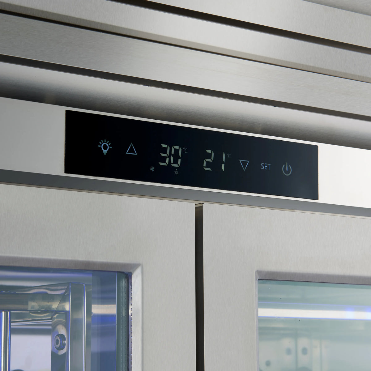 Wine cooler control panel display with temperature settings and touch icons.