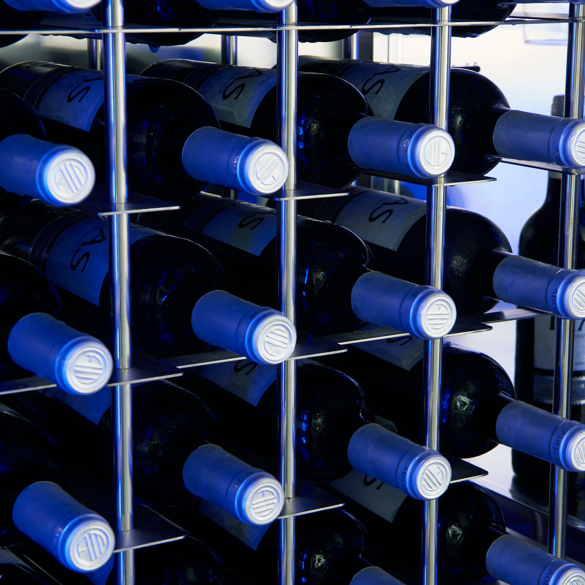 Wine cooler bottle storage with multiple rows of dark wine bottles