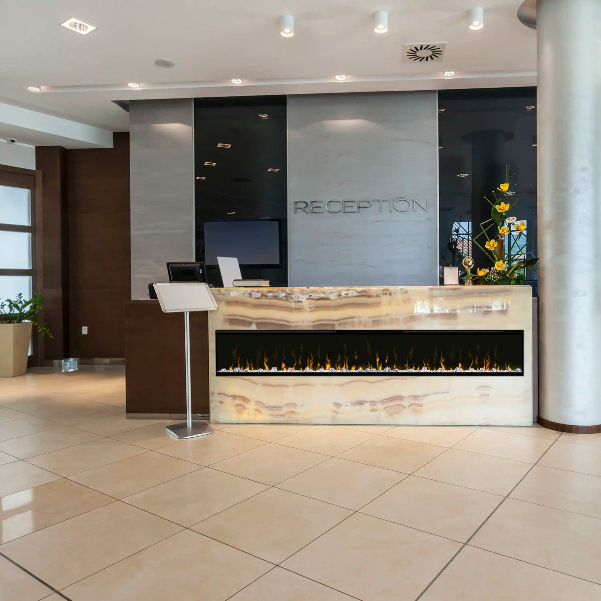 Built-in linear electric fireplace with orange flame display and black surround