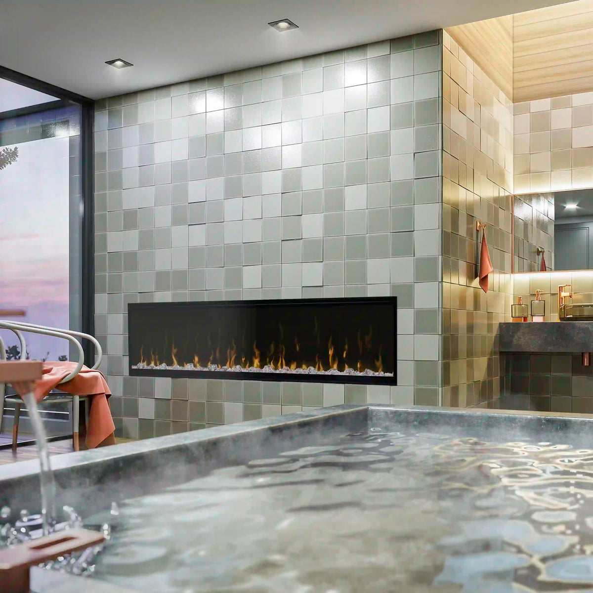 Linear electric fireplace insert with black glass front and flame display on tiled wall