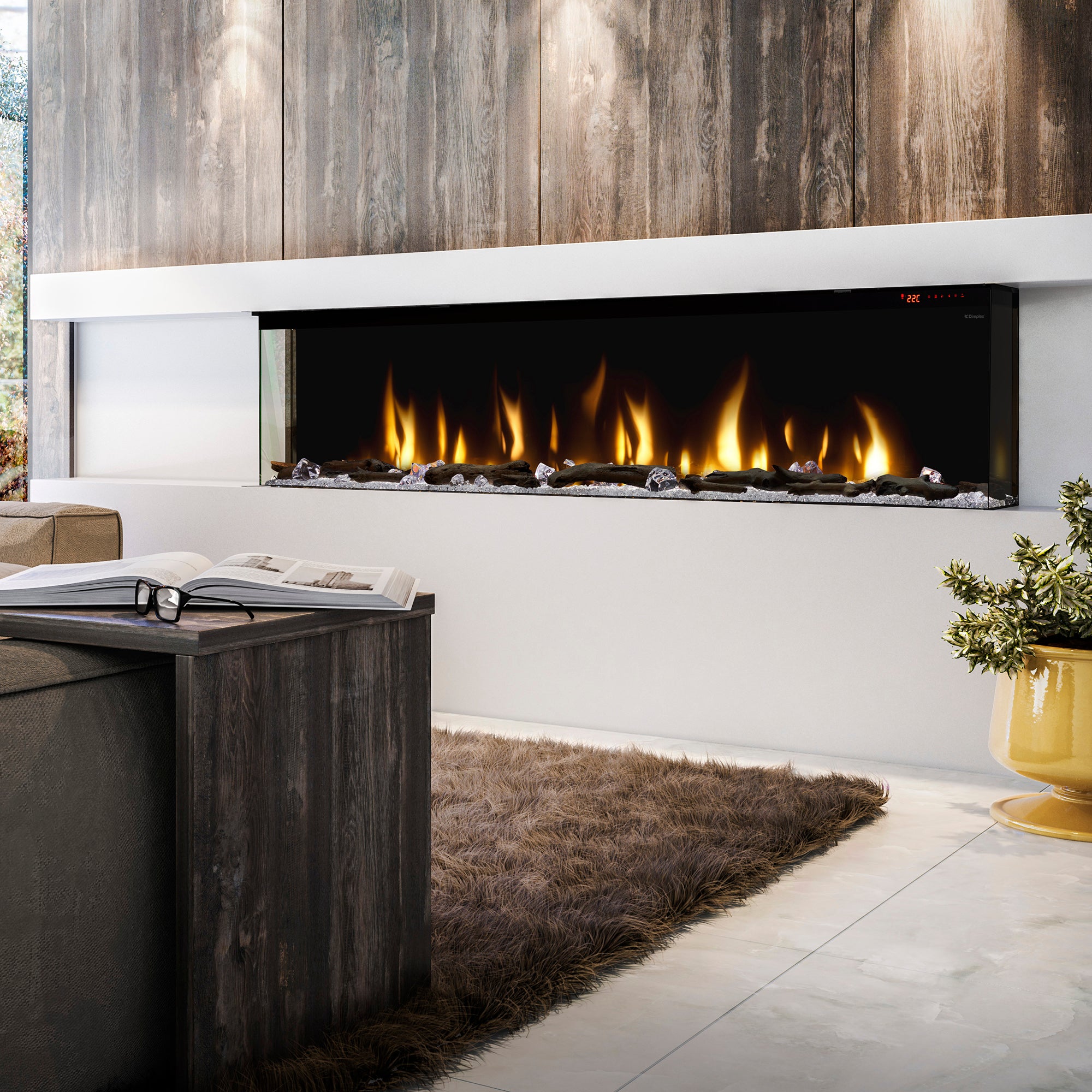 Built-in linear electric fireplace with yellow-orange flames in a recessed black frame