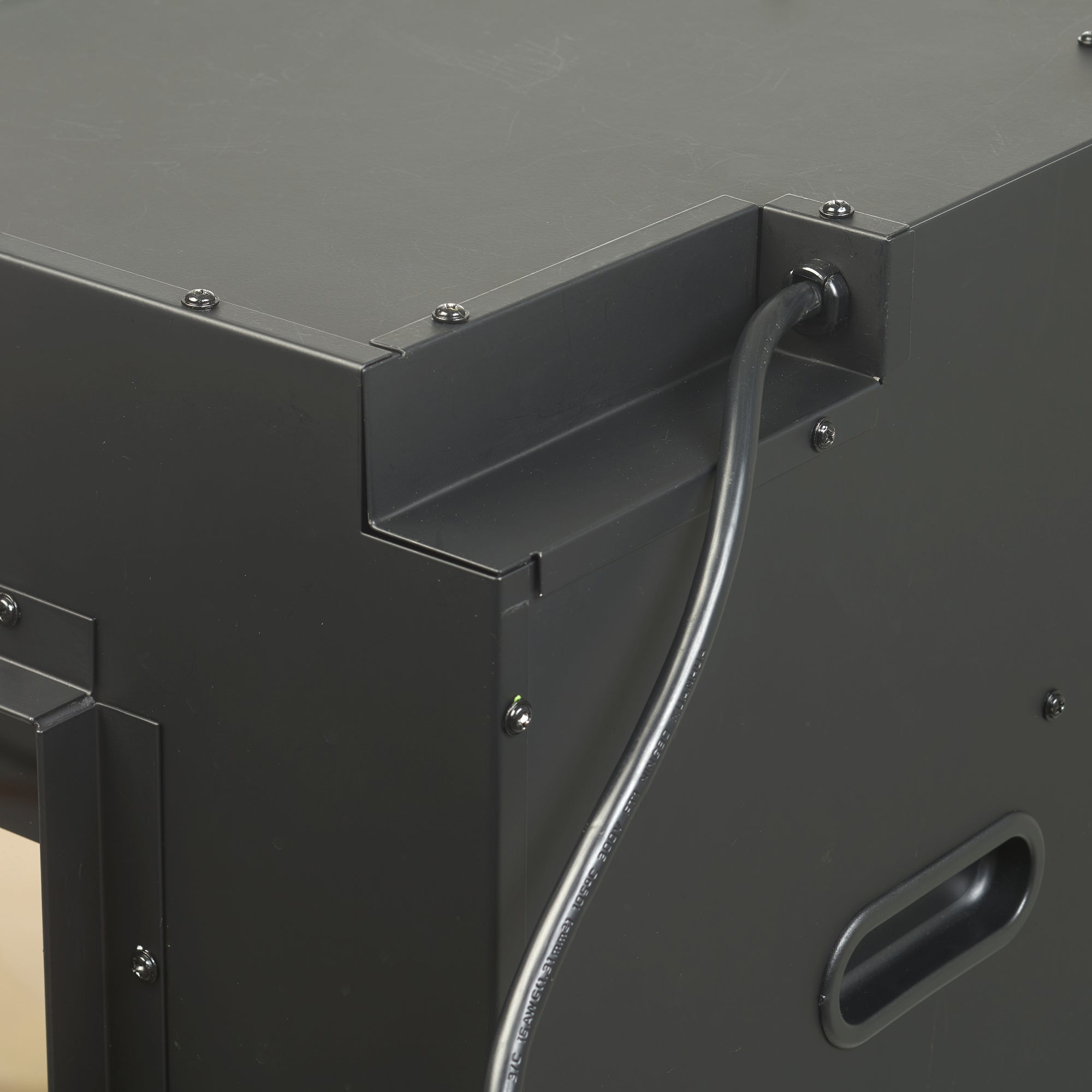 Black built-in linear electric fireplace cabinet with side handle and cable entry port