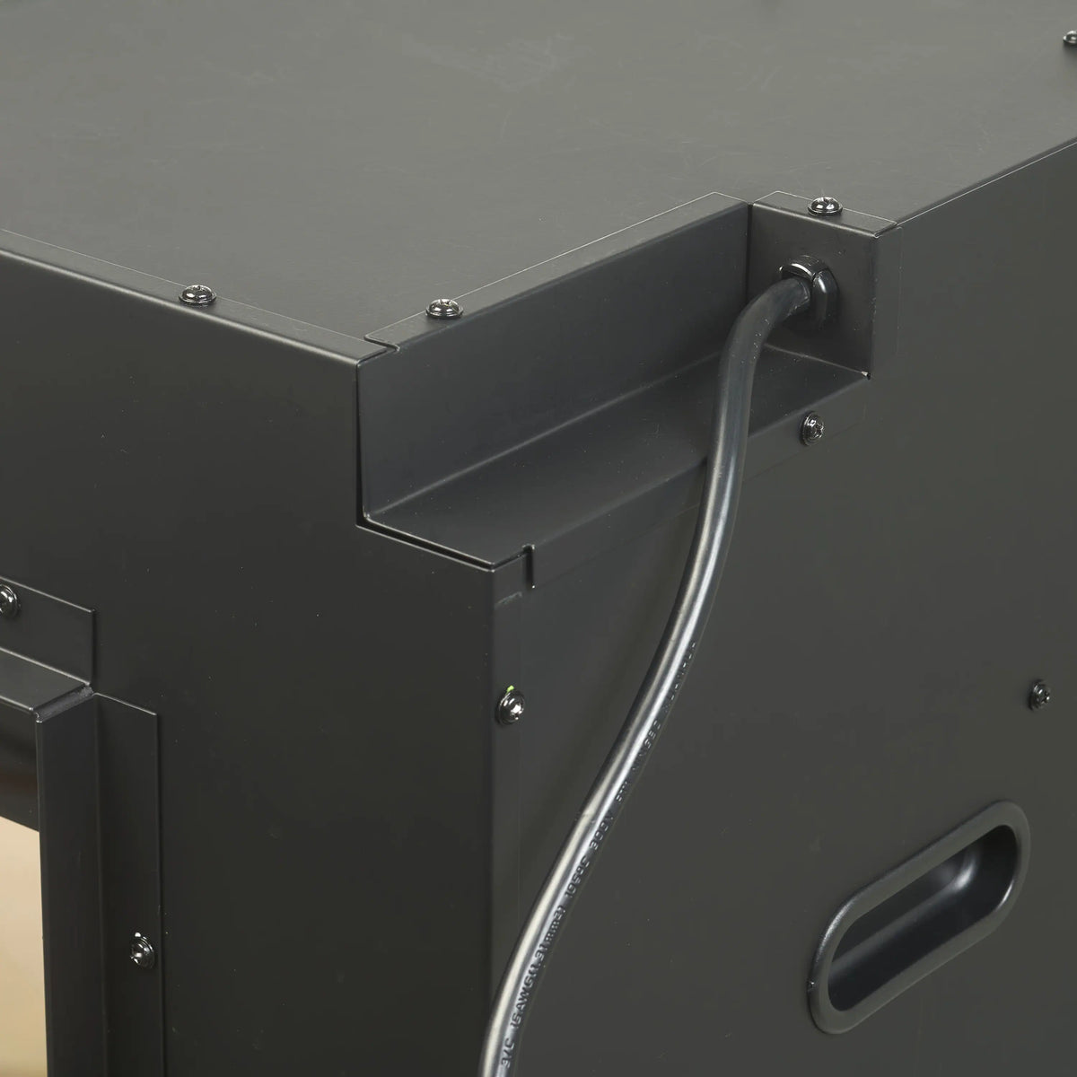 Black fireplace junction box corner with metal conduit and mounting screws