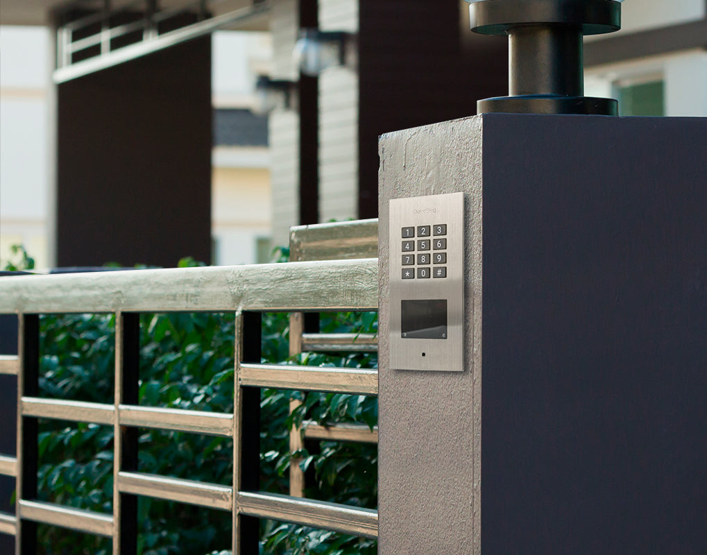 Outdoor flush-mount keypad access device on metal gate post, titanium finish