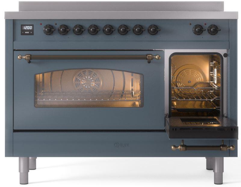 Induction range front with oven door open, lit oven cavity and racks visible
