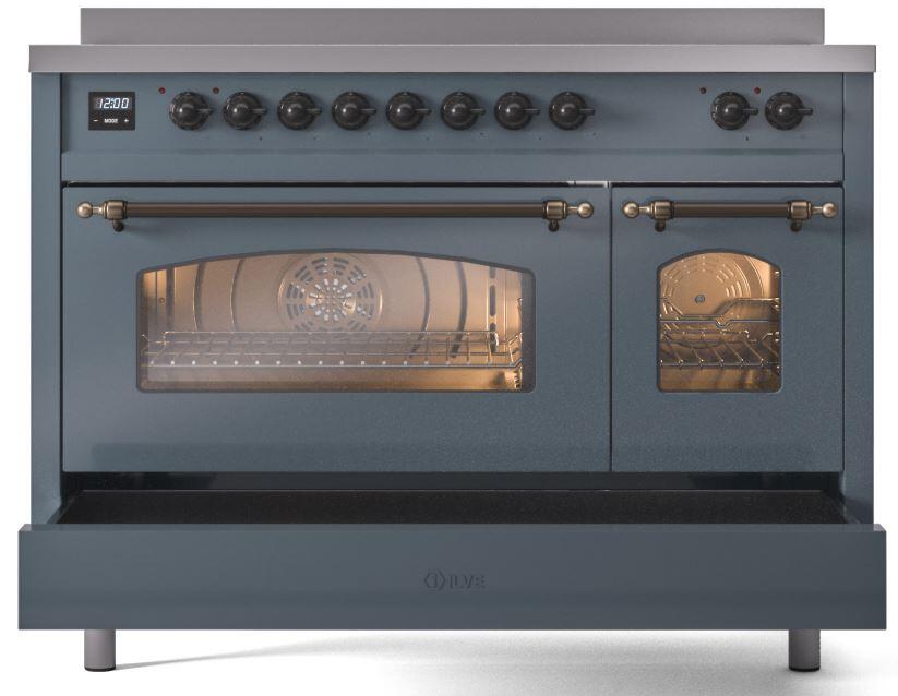 Freestanding electric induction range front view, oven window lit, bronze handles and knobs