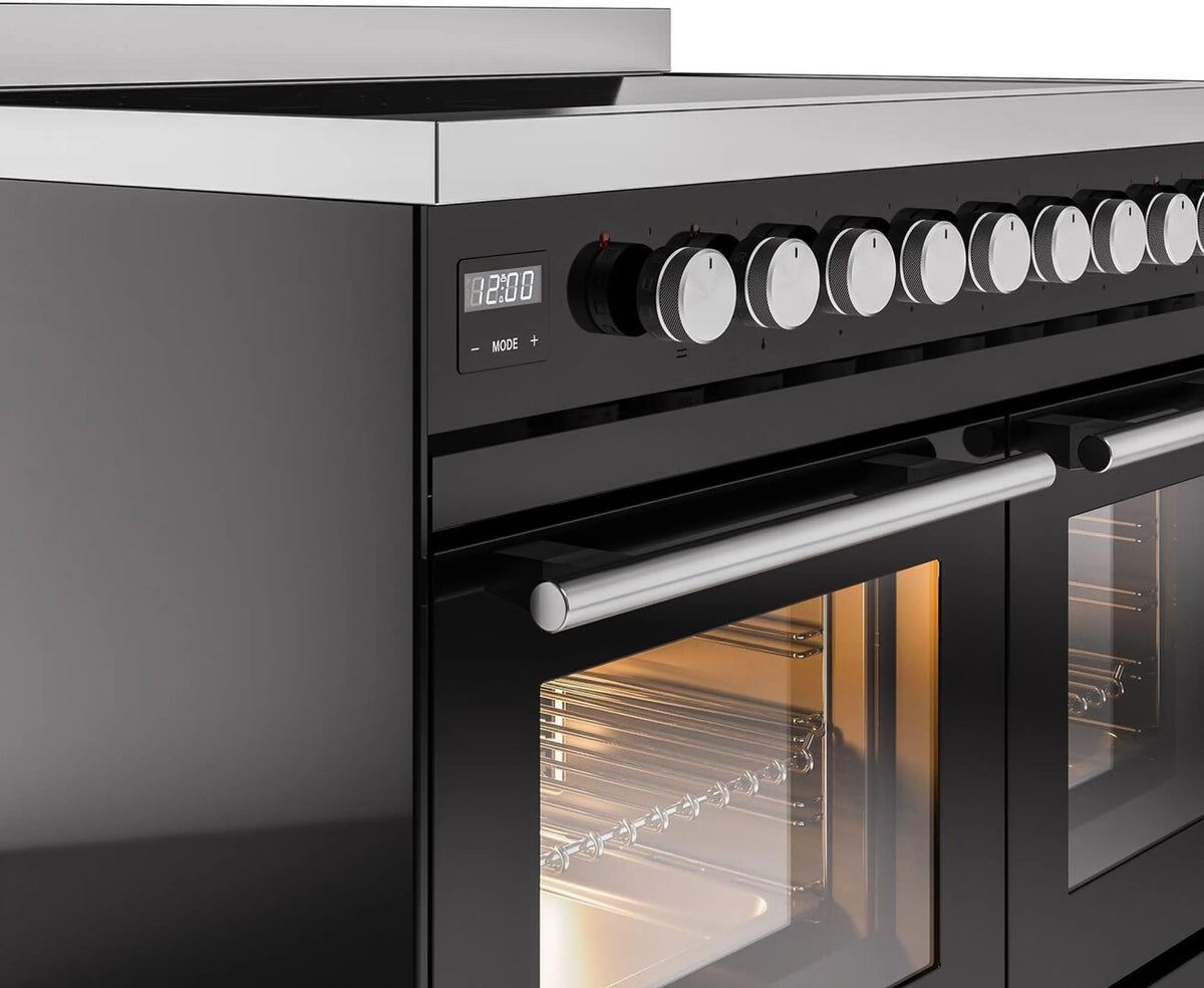 Black induction range control area with row of white knobs and lit oven door