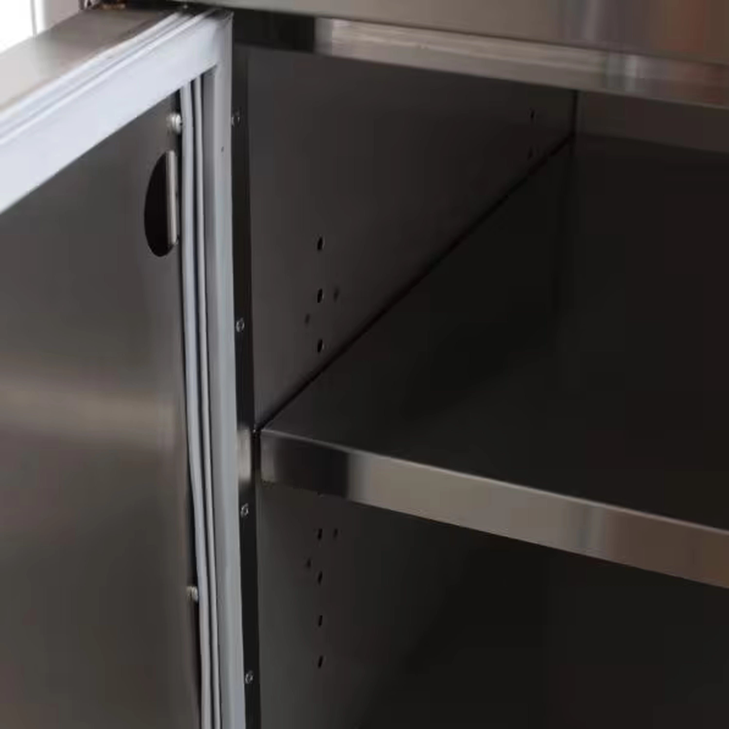 Stainless steel pantry side interior with perforated panels and shelf